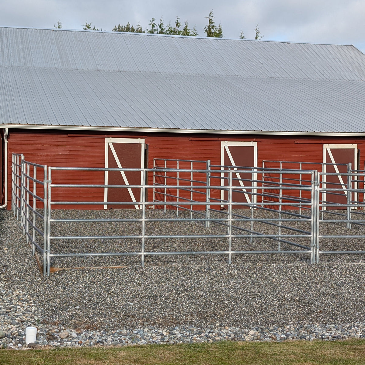 Self care horse boarding stall with connected pea gravel run